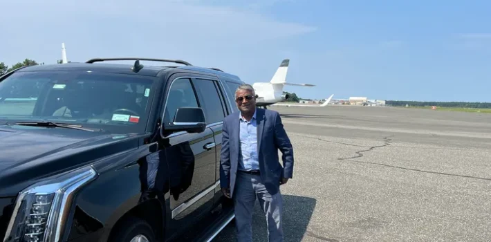 chauffeur waiting for passenger in Newark Airport