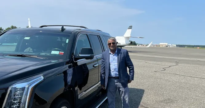chauffeur waiting for passenger in Newark Airport