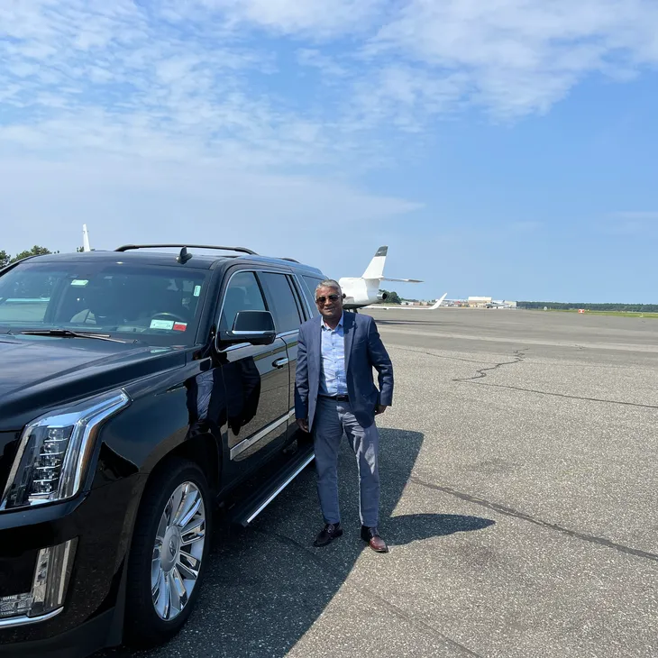 chauffeur waiting for passenger in Newark Airport