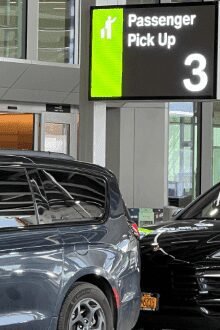 Newark Airport Terminal C car service pickup sign for FHV passengers.