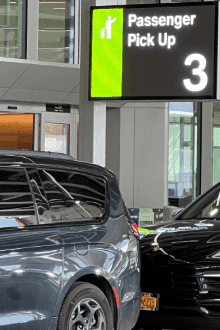 Newark Airport Terminal C car service pickup sign for FHV passengers.